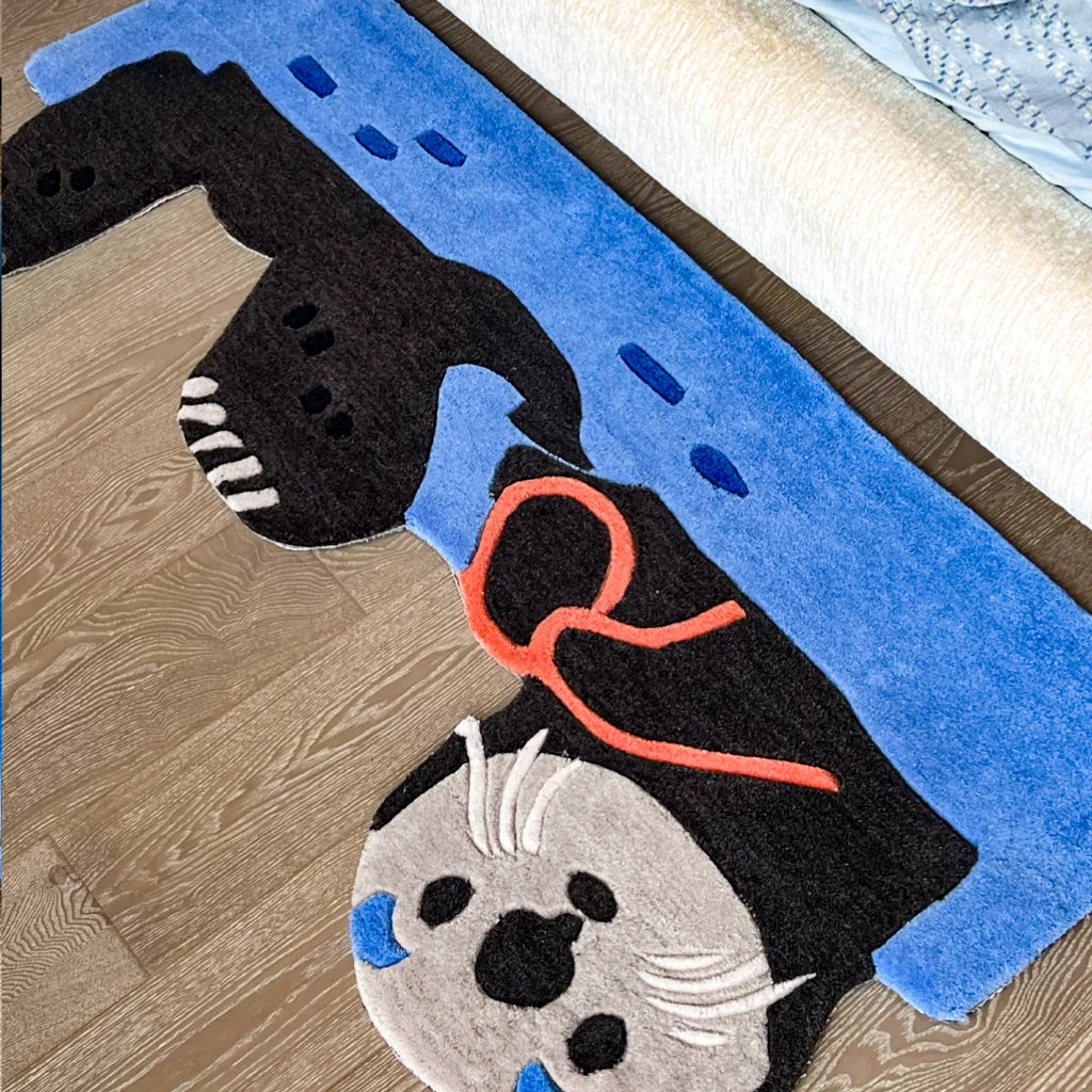 Oona Blue Water Sea Otter Shaped Graphic Tufted Rug