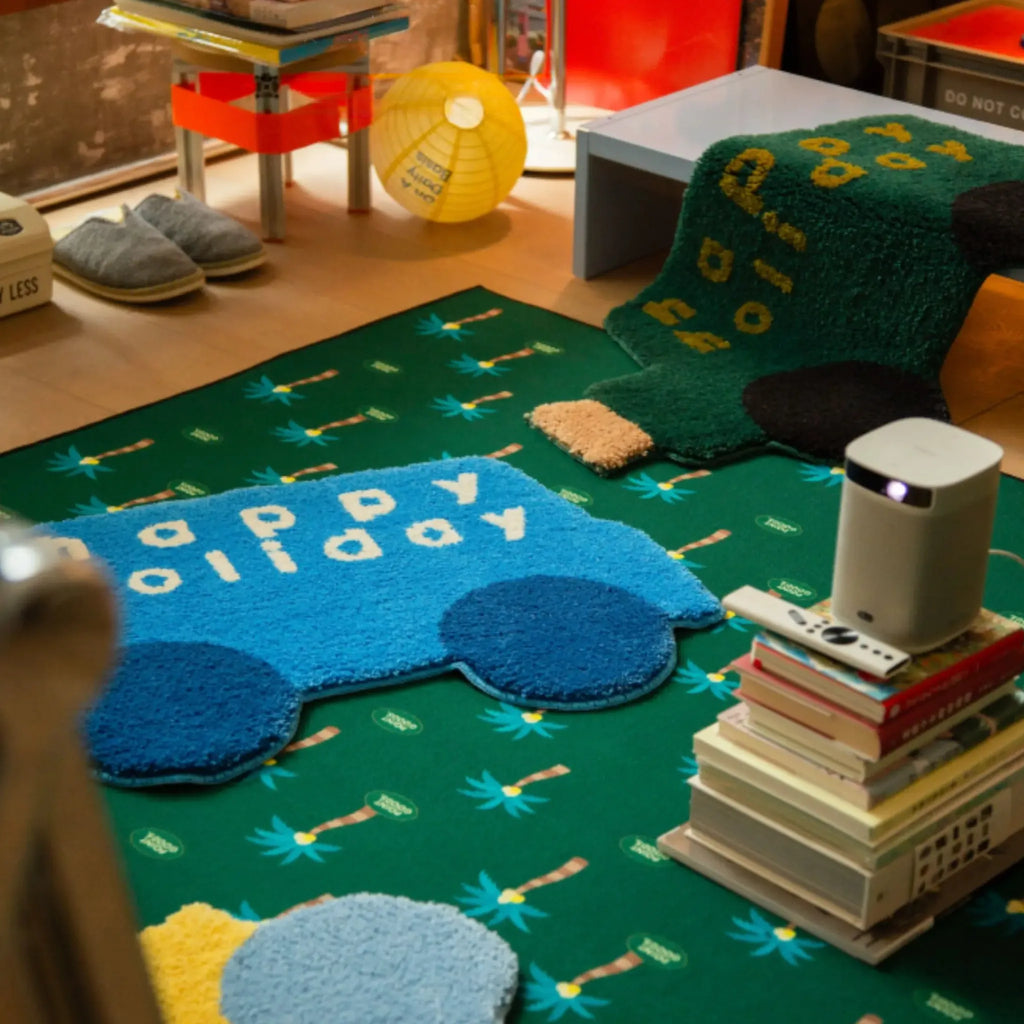 Pip Blue & Navy Happy Holiday Graphic Car Shaped Tufted Rug by Housenfriends with forest green car rug, colourful graphic word art rugs on green floor