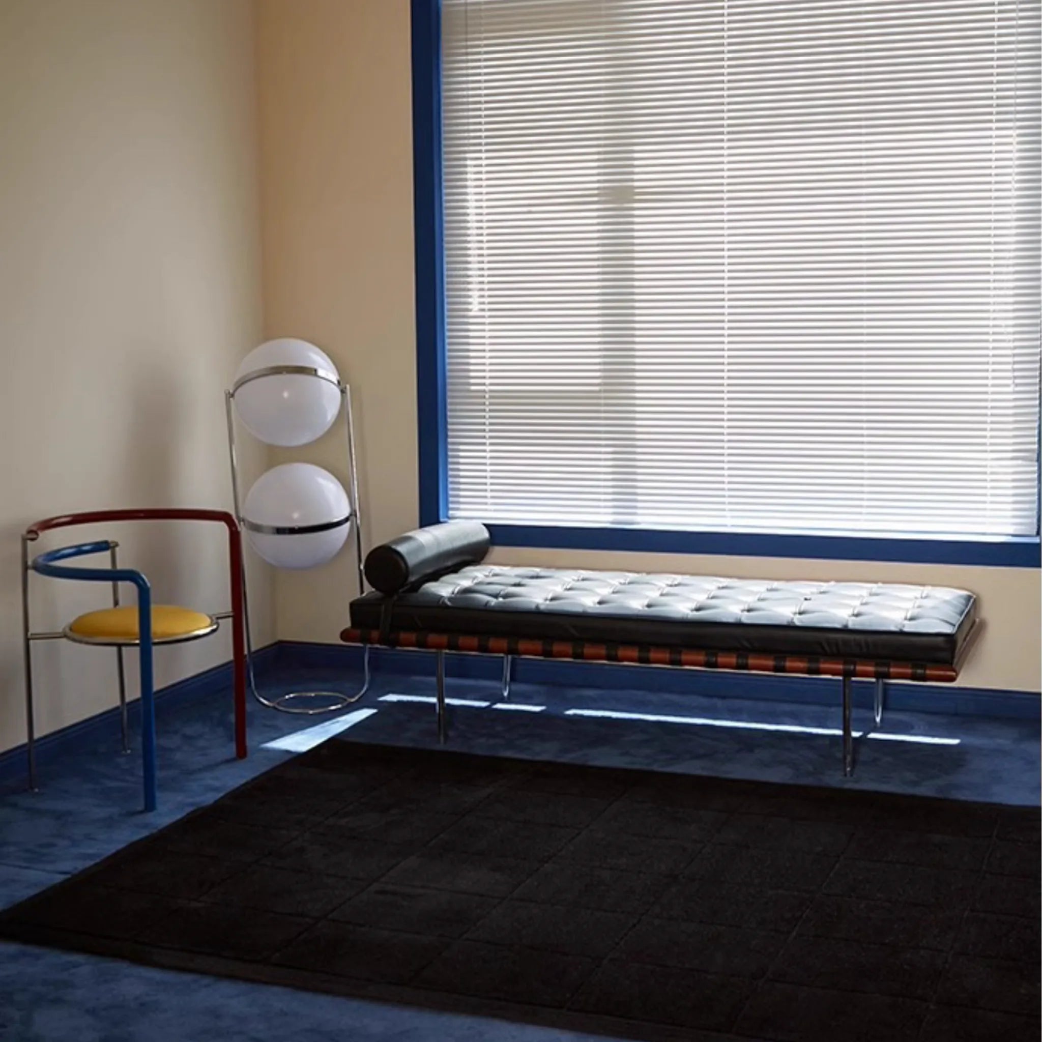 Modern room interior with a bench, chair, and lamp near Pure Black Minimalist Modern Rug by Housenfriends