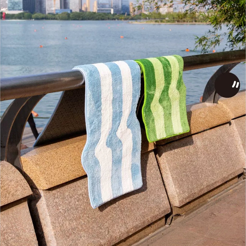 Rafi Green & Lime and Pastel Blue Wavy Striped Tufted Runner Rugs on railing by water, with summer outdoor mood by Housenfriends
