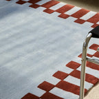 Close-up of Acropolis Slate Blue and Red High Low Tufted Wool Rug by Housenfriends
