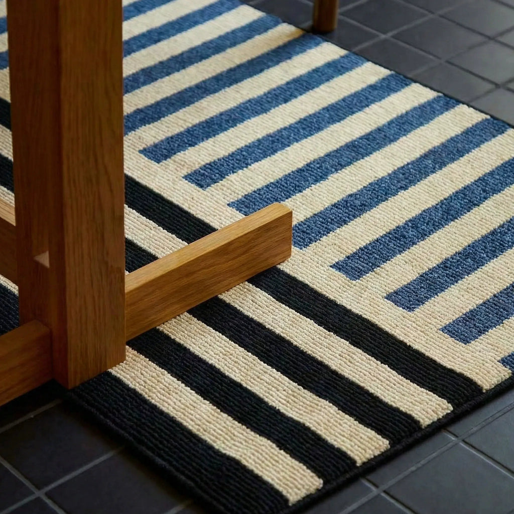 Soren Cream Black & Blue Block-Stripe Textured Rug by Housenfriends in a doorway setting