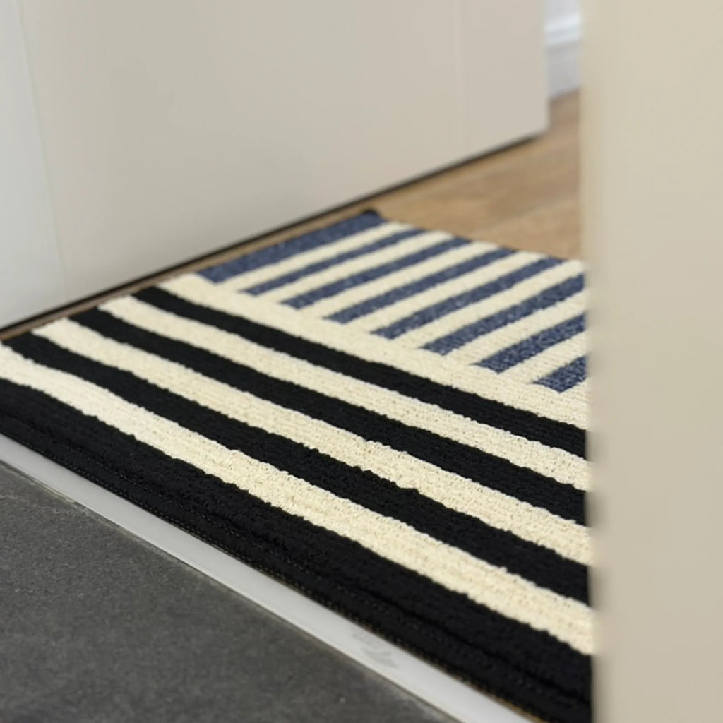 Soren Cream Black & Blue Block-Stripe Textured Rug by Housenfriends styled in a kitchen entry