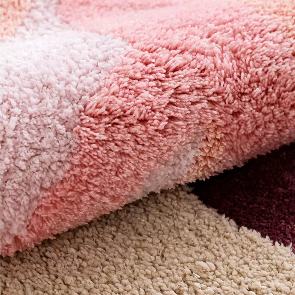 Close up of thick pastel pink tufted pile and cream abstract detail on Willa soft high pile rug by Housenfriends