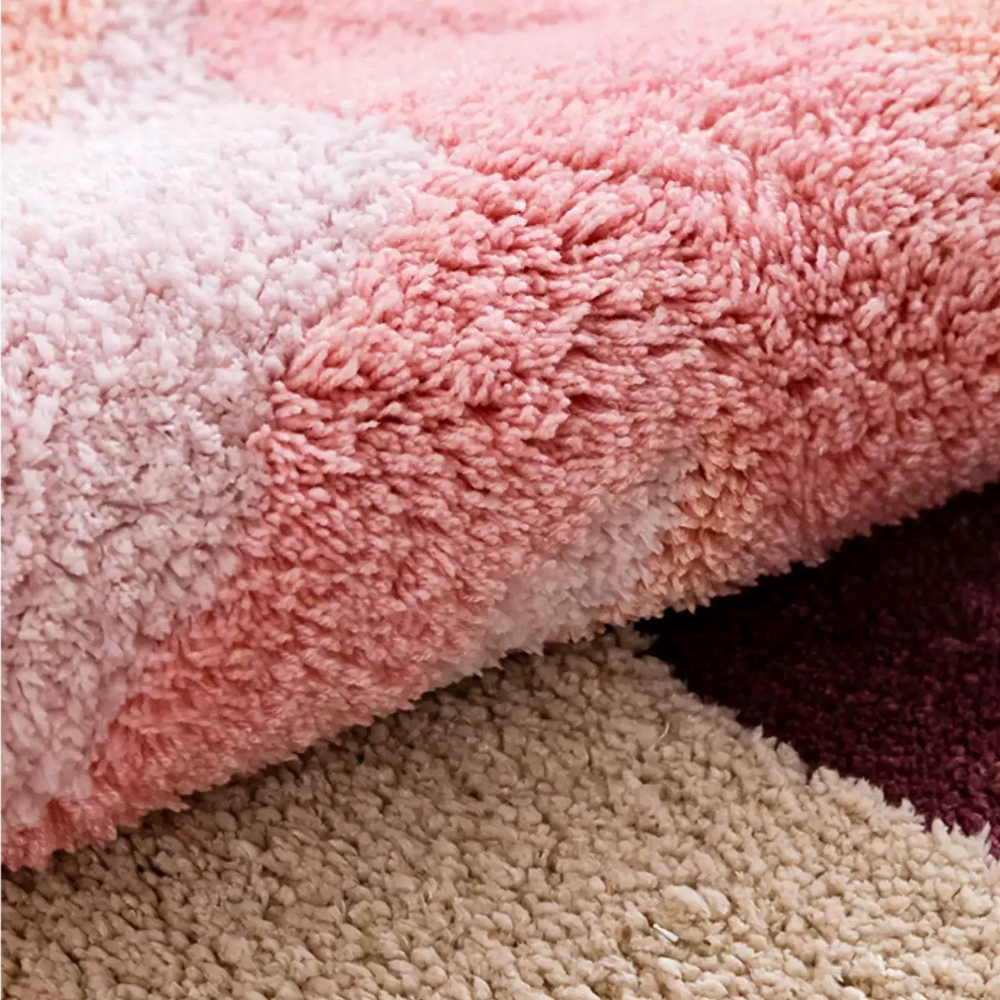 Close up of thick pastel pink tufted pile and cream abstract detail on Willa soft high pile rug by Housenfriends