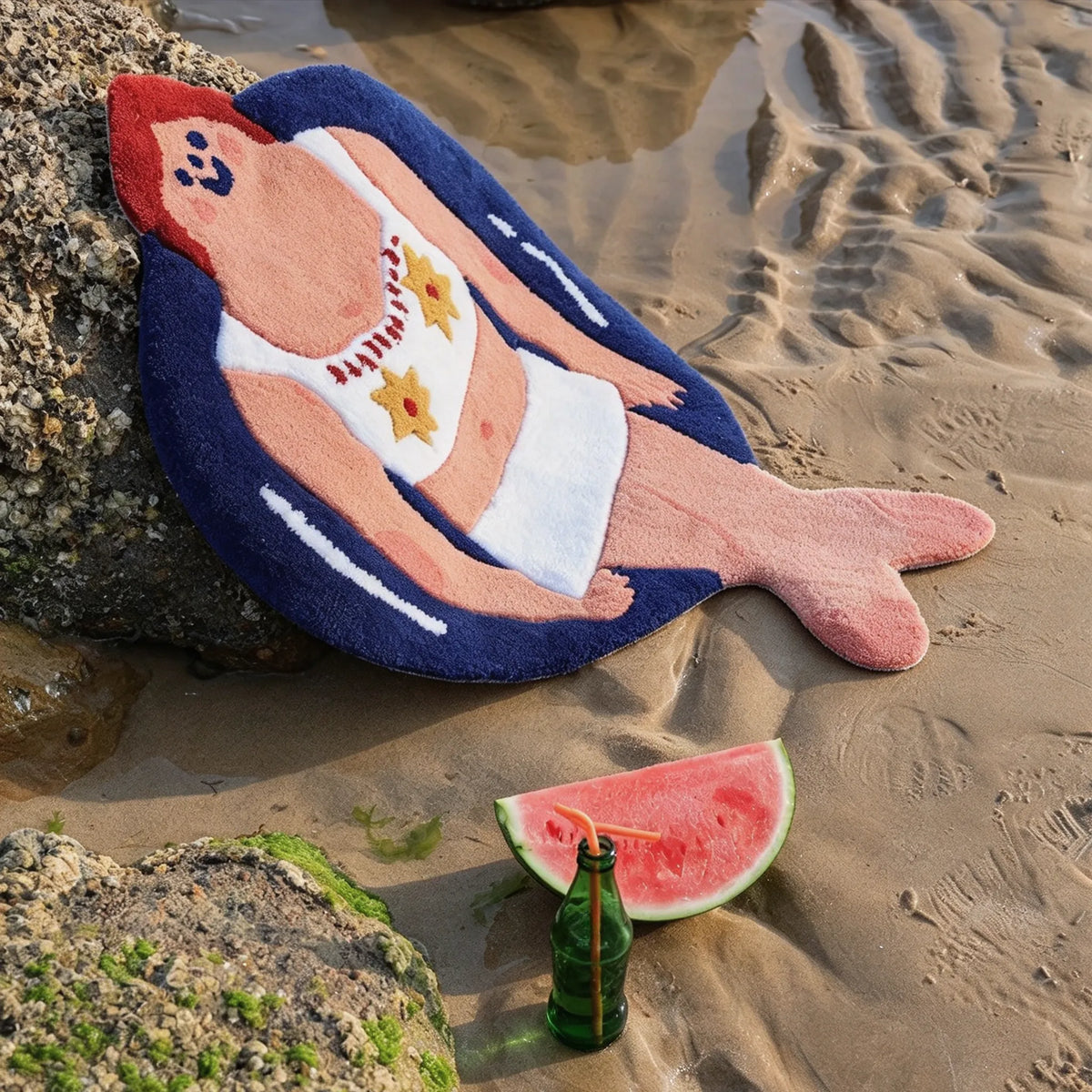 Housenfriends June swimming girl tufted rug in a white floral swimsuit and navy blue swim ring, relaxing on the sand beside a watermelon slice.